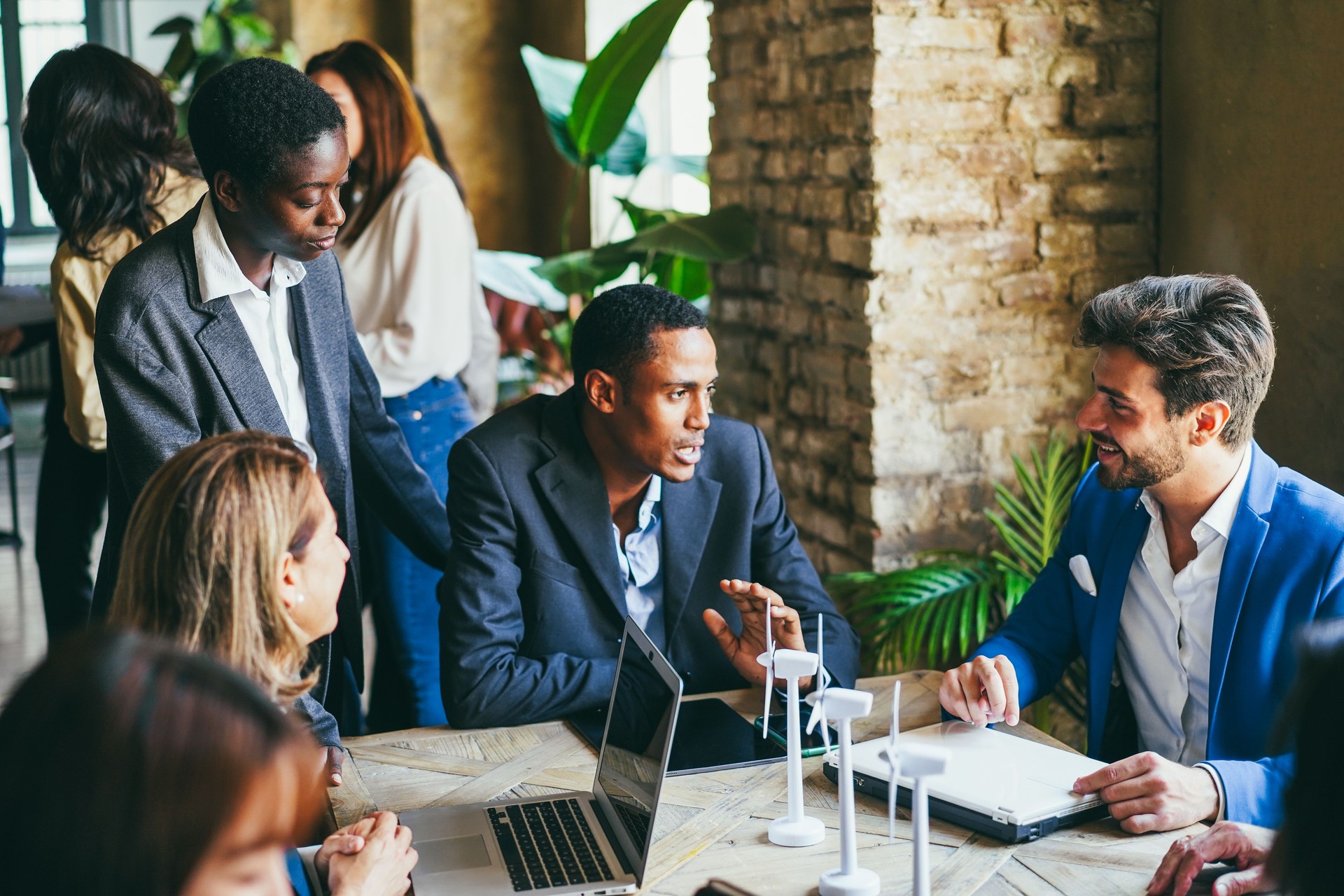 Multiracial business people working on sustainable innovation project - Green renewable energy concept - Focus on african girl face