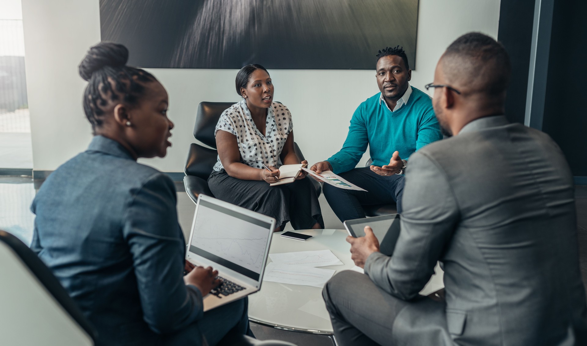 Team of african bussines people debating during a work meeting. Colleagues in serious discussions